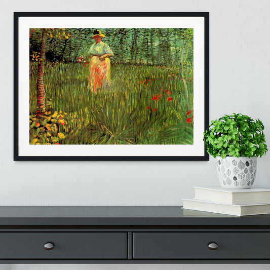 A Woman Walking in a Garden by Van Gogh Framed Print