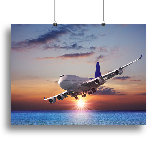 Jet liner over the sea at dusk Canvas Print or Poster